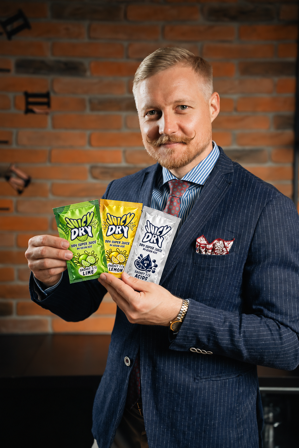 Kevin Kos holding JuicyDry™ Lime, Lemon and Acids sachets